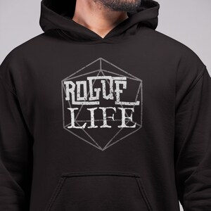May include: Black hooded sweatshirt with a white graphic of a 20-sided die with the words "Rogue Life" inside.