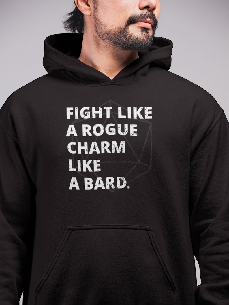 May include: Black hooded sweatshirt with a white graphic print that reads "Fight like a rogue, charm like a bard." The graphic also includes a stylised image of a 20-sided die.