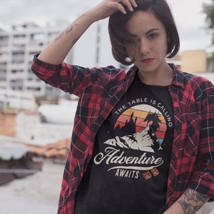The table is calling adventure awaits dnd t-shirt design on a trendy young woman with in the city