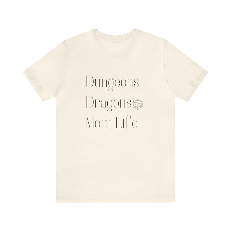 May include: A white t-shirt with the text "Dungeons Dragons Mom Life" and a Dungeons and Dragons dice symbol.