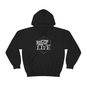 May include: Black hooded sweatshirt with a white graphic of a dice with the text "ROGUE LIFE" inside.