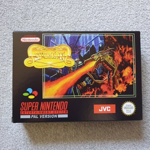 May include: A black Super Nintendo Entertainment System game cartridge case featuring a gold dragon and knight design. The game title is "Wyvern" and the case includes the text "Licensed by Nintendo" and "PAL Version".