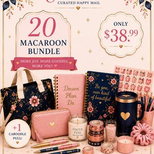 May include: A curated bundle featuring a navy floral tote bag, two spiral notebooks with pink and navy covers, a pink zippered pouch, a navy mug with a gold heart, three candles, pens, washi tape, a pink scrunchie, and a sheet of stickers.