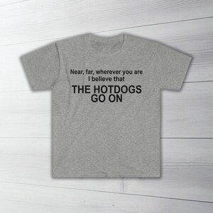 The Hotdogs Go On - Unisex Softstyle T-Shirt