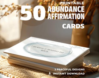 May include: A stack of white affirmation cards with the text "I AM WORTHY OF ABUNDANCE AND WEALTH" on the top card. The image also includes the text "50 PRINTABLE ABUNDANCE AFFIRMATION CARDS" and "3 PEACEFUL DESIGNS INSTANT DOWNLOAD".