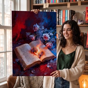 May include: An open book with flames at its center, surrounded by roses and ice crystals. The artwork features a dramatic color palette of red, blue, and white, creating a striking visual contrast. The image evokes themes of fantasy and literature.