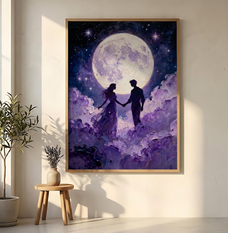 May include: A framed art print depicts a couple holding hands, silhouetted against a large, luminous moon. The artwork features a palette of purples and blues, with a starry night sky and fluffy clouds.