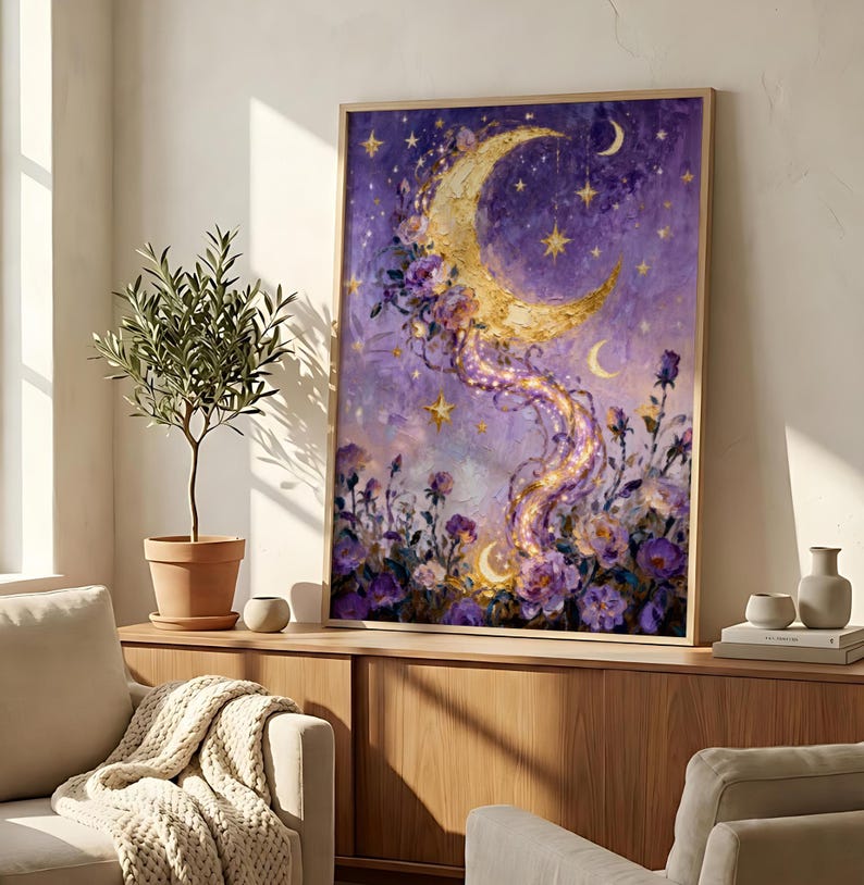 May include: A framed artwork featuring a crescent moon with a golden glow, adorned with purple flowers and stars against a purple and blue background. The artwork has a dreamy, celestial theme.