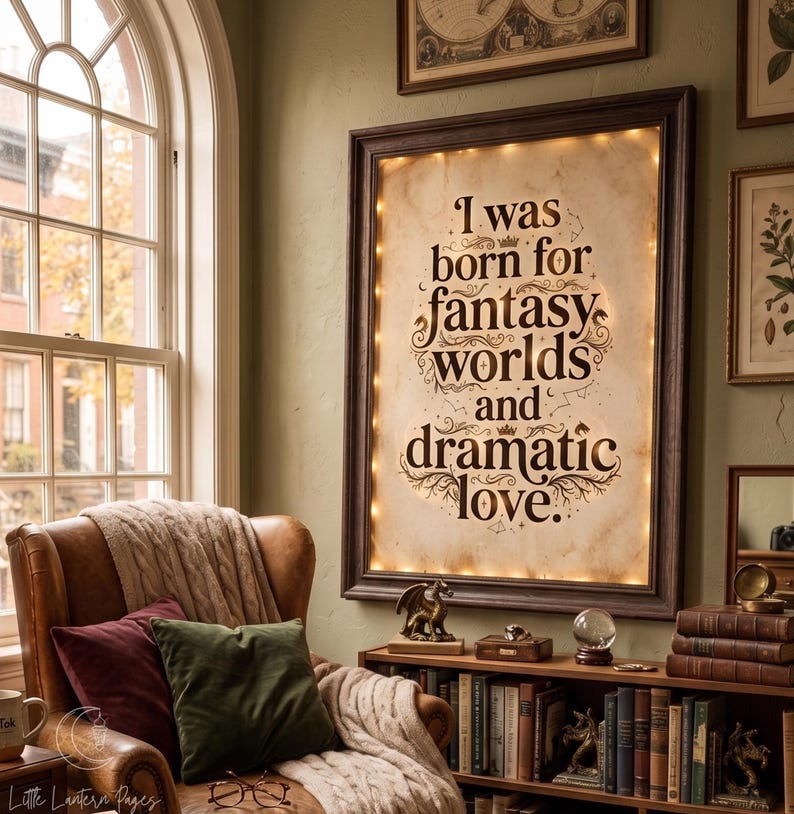 May include: A rectangular wall-mounted sign with a dark brown frame and internal warm lighting. The off-white center features the black text: I was born for fantasy worlds and dramatic love, surrounded by small decorative flourishes and stars.
