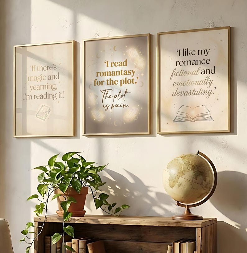 May include: Three framed art prints with gold frames, each featuring quotes about reading. The prints are displayed above a wooden shelf with a potted plant and a globe. The quotes include: "If there's magic and yearning, I'm reading it."