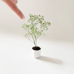 Dollhouse plant in faux-stone planter. Bright green plant made of 100% naturally preserved baby's breath perfect for adding charm to dollhouse decor, entryway or greenhouse.