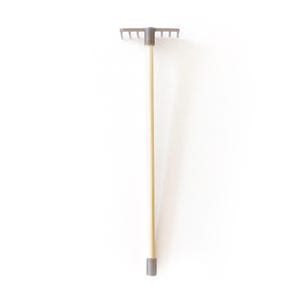May include: A gray metal rake with a wooden handle. The rake has a gray plastic handle and a gray metal head with tines.