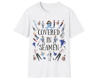 May include: White t-shirt with a graphic print of a cartoon octopus surrounded by cartoon sailors. The text "COVERED IN SEAMEN" is printed below the octopus.