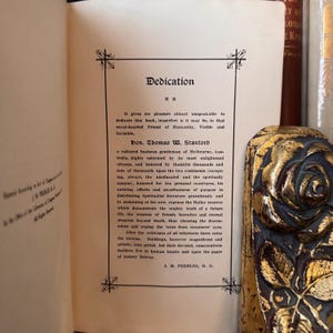 May include: A vintage book with a dedication page to Thomas W. Stanford, a cultured business gentleman of Melbourne, Australia. The text highlights his contributions to spiritualism and his support of the Bailey seances.