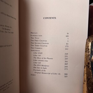 May include: Open book displaying a table of contents. The title "CONTENTS" is at the top. The table lists chapter titles and page numbers, including "Preface," "Introduction," and "Appendices."