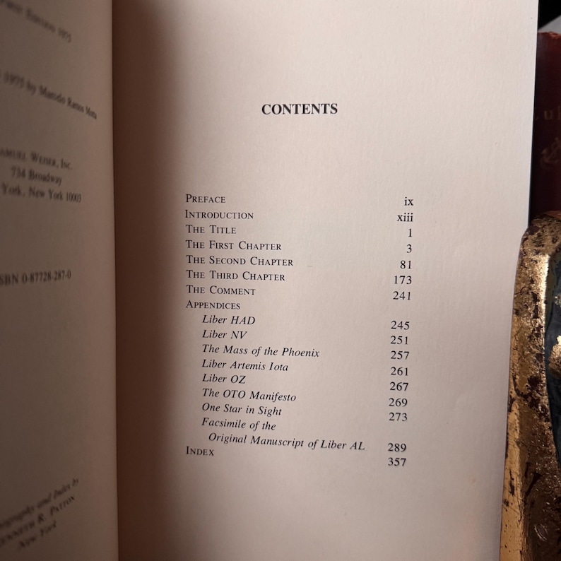 May include: Open book displaying a table of contents. The title "CONTENTS" is at the top. The table lists chapter titles and page numbers, including "Preface," "Introduction," and "Appendices."