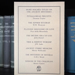 May include: A beige card with a list of book titles related to ancient mysteries, including "The Sepher Yetzirah", "Platonic Discourse on Love", and "Wisdom of the Chaldeans".