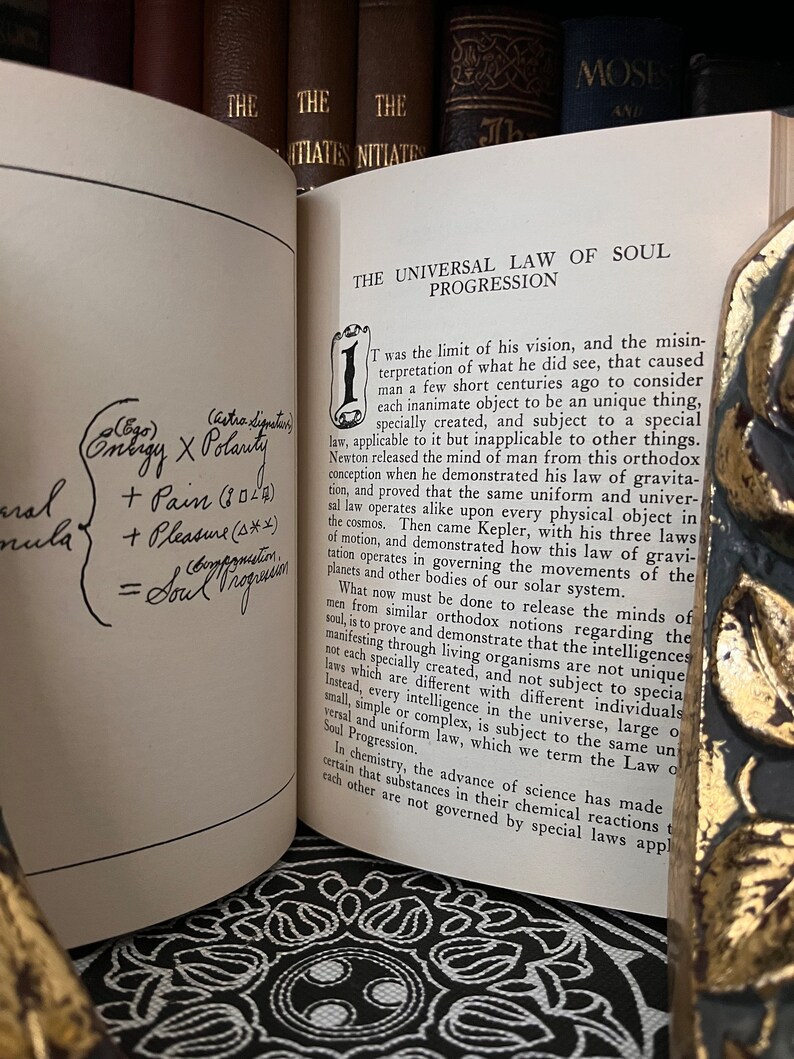 May include: A page from a book titled "The Universal Law of Soul Progression." The page is open to a chapter titled "1." The text discusses the concept of a universal law that applies to all things, including the soul. The text is written in a traditional serif font.