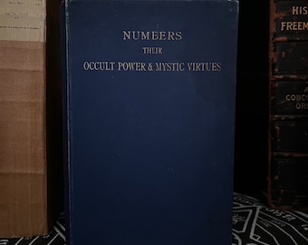 May include: A blue hardcover book with the title "Numbers Their Occult Power & Mystic Virtues" on the front cover.