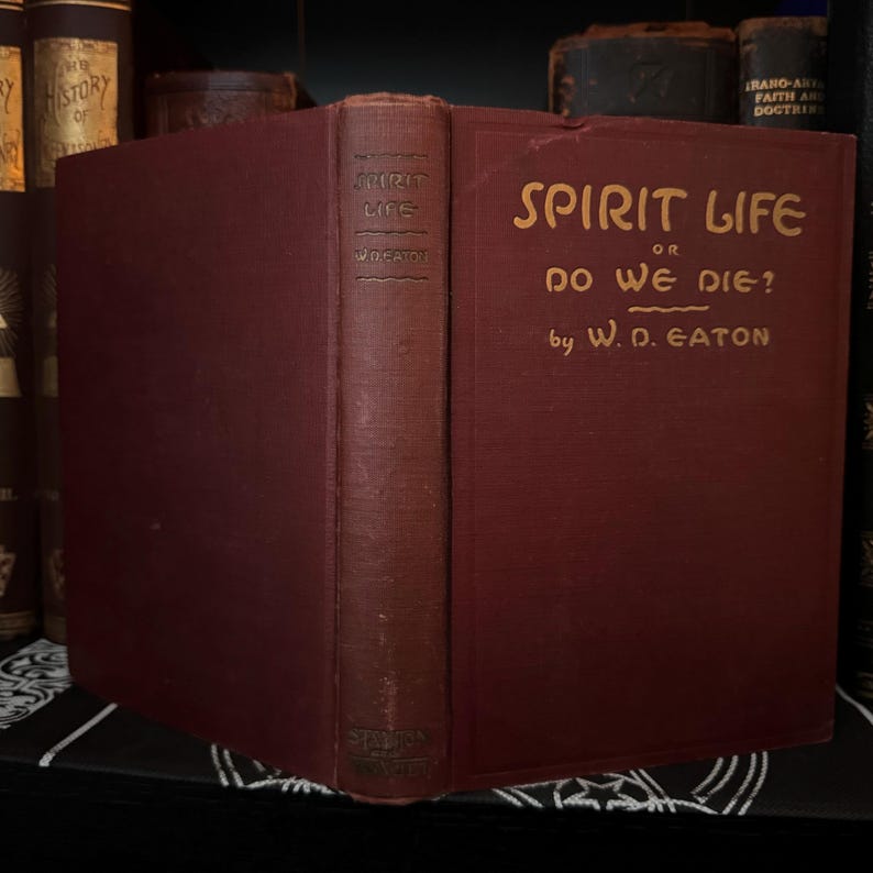 May include: A burgundy hardcover book titled "Spirit Life or Do We Die?" by W.D. Eaton.