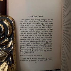 May include: A page from a book titled "Apparitions" with text about the history of a place called Falls Field, New York. The text describes the area as being near a river with a gorge and a quarry. The text also mentions a building contractor named Philip.