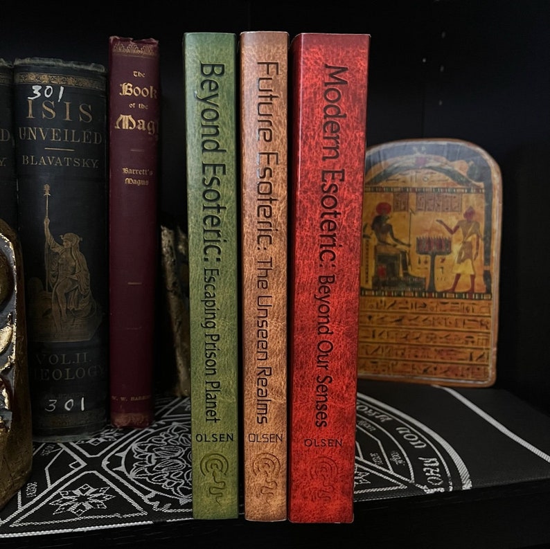 May include: Three hardback books with red, brown, and green covers. The books are titled "Modern Esoteric: Beyond Our Senses", "Future Esoteric: The Unseen Realms", and "Beyond Esoteric: Escaping Prison Planet". Each book has the author's name "OLSEN" printed on the cover.