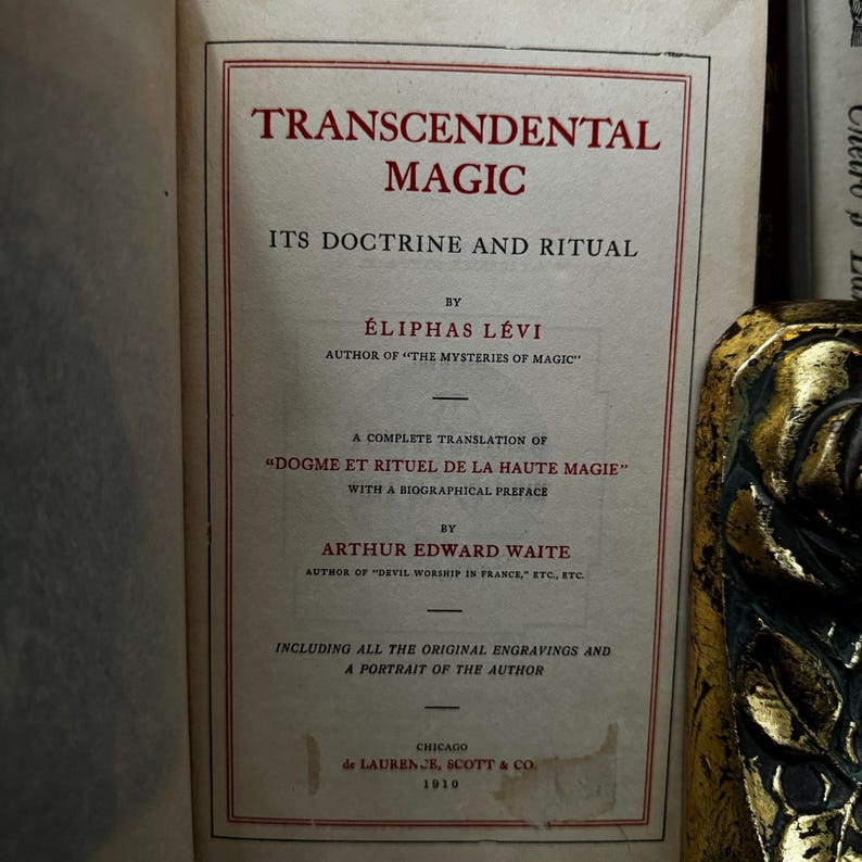 May include: A vintage book titled "Transcendental Magic: Its Doctrine and Ritual" by &Eacute;liphas L&eacute;vi, author of "The Mysteries of Magic". The book is a complete translation of "Dogme et Rituel de la Haute Magie" with a biographical preface by Arthur Edward Waite, author of "Devil Worship in France, etc., etc.". The book includes all the original engravings and a portrait of the author.