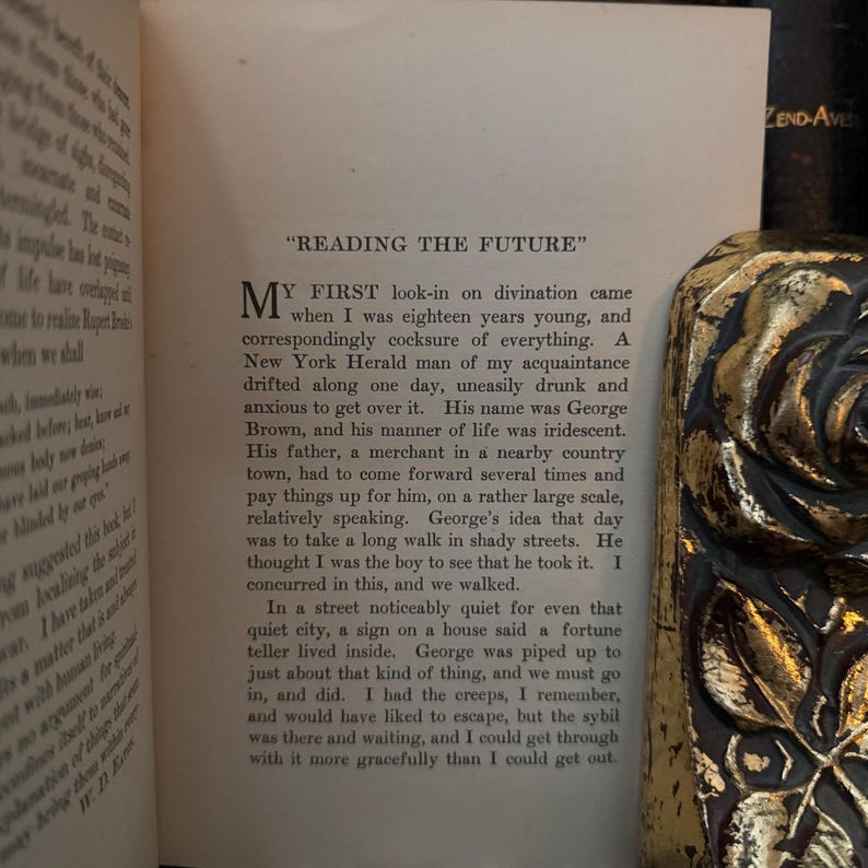May include: A vintage book with a yellowed page open to a chapter titled "Reading the Future". The text describes a young man named George Brown who is seeking a fortune teller.