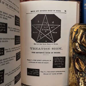May include: A black and white image of a book page with the title "Treatise Sion" and the text "The Seventh Book of Moses." The page also includes a black and white illustration of a five-pointed star with Hebrew text inside.