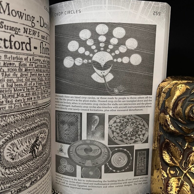 May include: A book page with a black and white image of a crop circle formation. The text on the page reads "Crop Circles" and "Obviously there are faked crop circles, or those made by people to throw others off the trail. But the proof is in the plant stalks. Hoaxed crop circles are trampled down and the stalks are broken, when in authentic crop circles the stalks are interwoven and the plants are not damaged. Authentic crop circles also interfere with aircraft instrumentation when flown directly over newly-created formations, plus other measured disturbances."