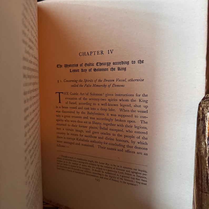 May include: Open book page with text titled "CHAPTER IV" and "The Mysteries of Go&euml;tic Cheurgy according to the Lesser Key of Solomon the King." The text describes the Go&euml;tic Art of Solomon and the spirits.