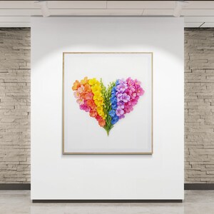 May include: A framed print of a heart shape made of colorful flowers. The flowers are arranged in a rainbow pattern, with red, orange, yellow, green, blue, and purple flowers.
