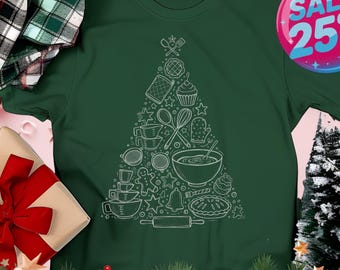 May include: A dark green t-shirt featuring a white outline of a Christmas tree made of baking-themed illustrations. The shirt includes a sale tag with "SALE 25% OFF" and the word "forest" on a banner.