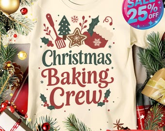 May include: A cream-colored t-shirt with the text "Christmas Baking Crew" in green and red. The shirt features festive graphics of a whisk, Christmas tree, star cookie, and cupcake. A sale tag shows 25% off.