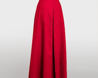 May include: A long, red skirt with a high waist and a single pleat in the back.