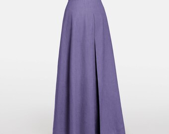 Falda larga maxi de lino morado, plisada, corte en A y con bolsillos.