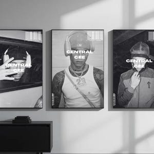 May include: Three black and white framed posters featuring the same person. Each poster has the text "CENTRAL CEE" in a white font. The person is wearing different outfits and accessories in each poster.