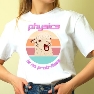May include: White t-shirt with a retro-style graphic of a llama with the text "physics is no prob-llama" in pink.