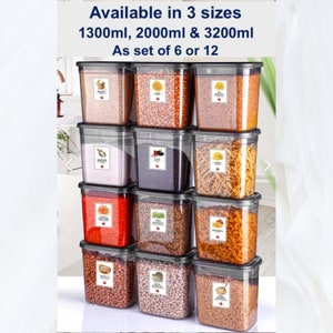 May include: Set of 12 clear plastic storage containers with black lids. The containers are stacked in three rows of four. Each container has a label with a different food item written on it. The containers are available in three sizes: 1.3 litres, 2 litres, and 3.2 litres. Available as a set of 6 or 12.