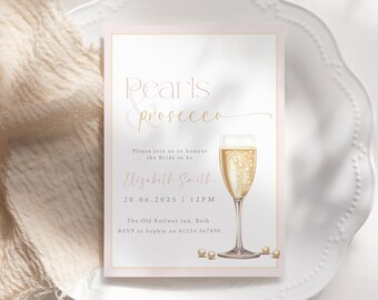 May include: A pink and gold bridal shower invitation with the text "Pearls & Prosecco" and a glass of champagne. The invitation includes the bride-to-be's name, the date and time of the event, the location, and RSVP information.