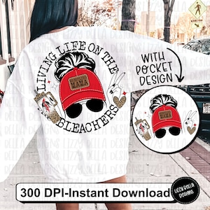 May include: White sweatshirt with a graphic design of a woman with a messy bun wearing a red baseball cap that says "Wrestling Mama" and sunglasses. The graphic is in a circle with the text "Living Life on the Bleachers" around it. The sweatshirt also has a pocket with a smaller version of the graphic design.
