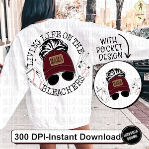 May include: A white sweatshirt with a graphic design of a woman with a messy bun wearing a baseball cap that says "Mama" and sunglasses. The graphic also includes the text "Living Life on the Bleachers" and a baseball. The text "With Pocket Design" is also included on the image.
