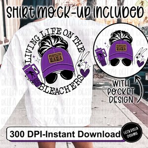 May include: A white sweatshirt with a purple and black graphic design that says "Living Life on the Bleachers" with a wrestling mama graphic. The design includes a purple baseball cap with the words "Wrestling Mama" on it, sunglasses, and a peace sign. The graphic is in a circle with a white background. The sweatshirt has a pocket on the front.