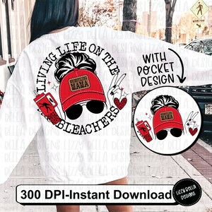 May include: White sweatshirt with a black and red graphic design that says "Living life on the bleachers with pocket design". The graphic features a woman with a red baseball cap that says "Wrestling Mama" and sunglasses.