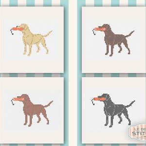 Puede incluir: Cuatro retratos de perros en punto de cruz enmarcados. Cada perro es de un color diferente: beige, marr&oacute;n, marr&oacute;n rojizo y negro. Cada perro sostiene un juguete naranja en la boca. El logotipo de Le Beau Stitch est&aacute; en la esquina inferior derecha.