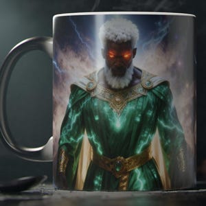 May include: A black coffee mug featuring a detailed illustration of a powerful figure with glowing red eyes, white hair, and a long white beard. The figure is wearing a green and gold robe with lightning effects. The background shows a stormy sky.