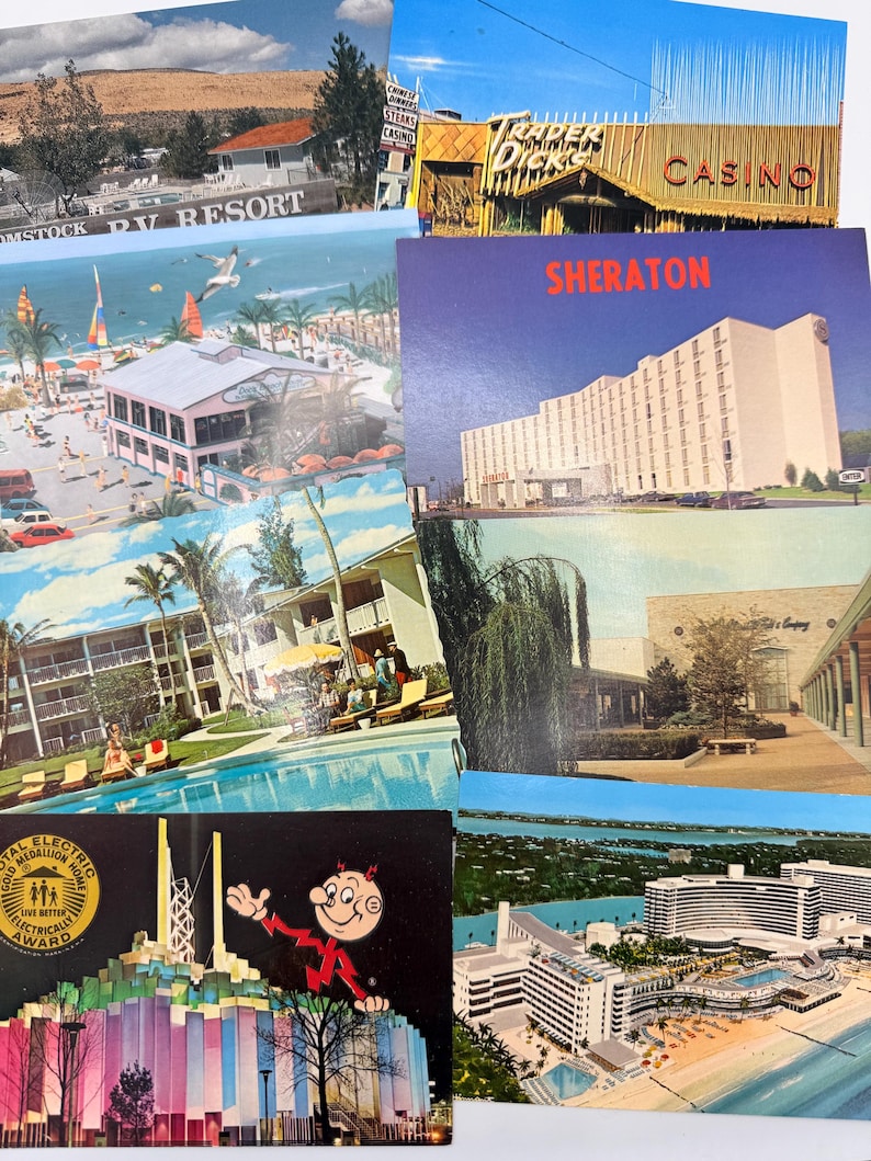 May include: A collection of vintage postcards featuring various scenes including the Comstock RV Resort, Trader Dick's Casino, a Sheraton hotel, a beach resort with a pool, a shopping center, and a building with a Gold Medallion Home award graphic.