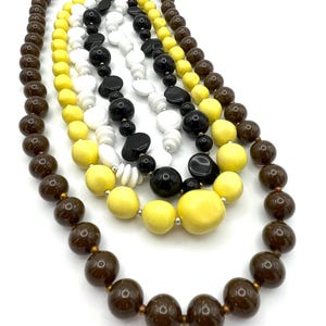 Lot of 4 Vintage Beaded Necklaces - Brown Speckle, Yellow, White, and Black