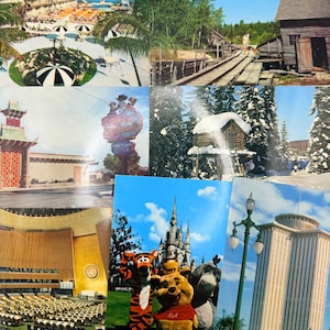 May include: A collection of seven vintage postcards featuring diverse scenes including a tropical resort with black and white umbrellas, a rustic wooden mill, a neon sign, a snow-covered cabin, a large auditorium, Disney characters, and a tall building.