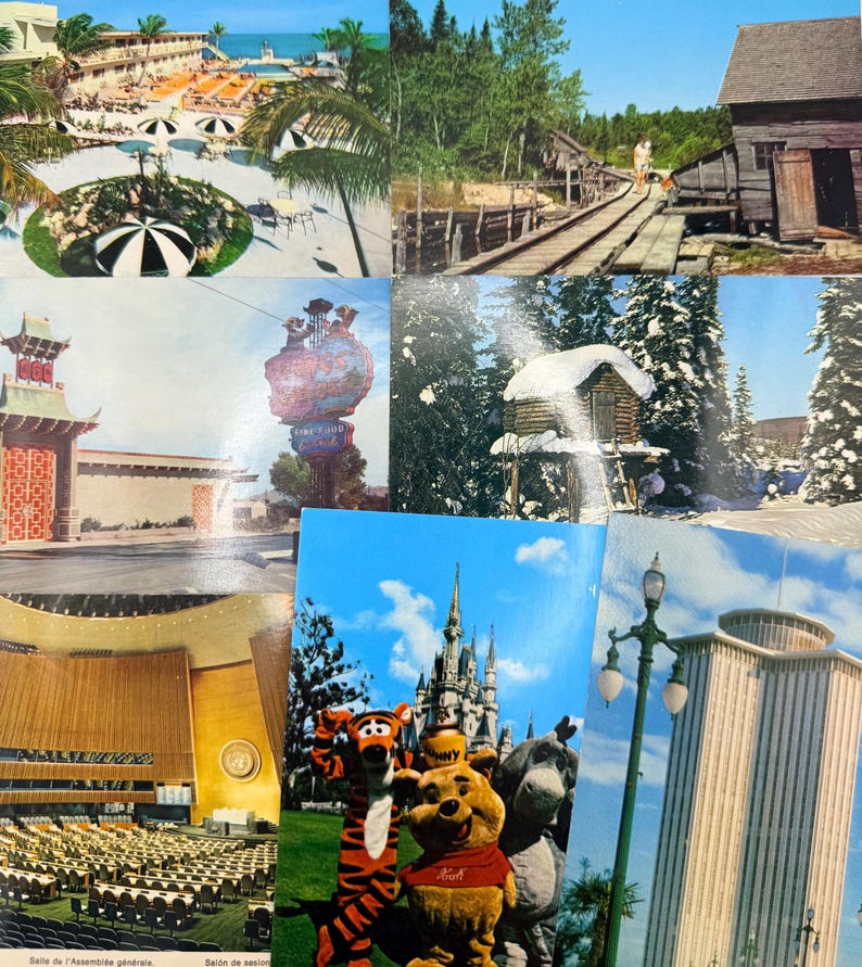 May include: A collection of seven vintage postcards featuring diverse scenes including a tropical resort with black and white umbrellas, a rustic wooden mill, a neon sign, a snow-covered cabin, a large auditorium, Disney characters, and a tall building.